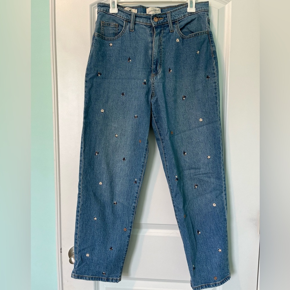 Jeans with stitched flowers